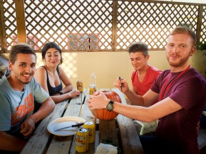 Jonatahn carving pumpkins with some students